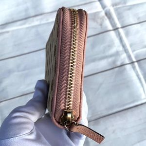 GUCCI GG Canvas Zippy Wallet - Image 11