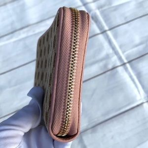 GUCCI GG Canvas Zippy Wallet - Image 12