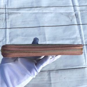GUCCI GG Canvas Zippy Wallet - Image 13